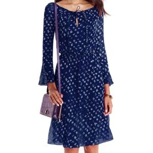 Silk dress with bell sleeves & ruffles. A timeless, feminine take on the ’70s.